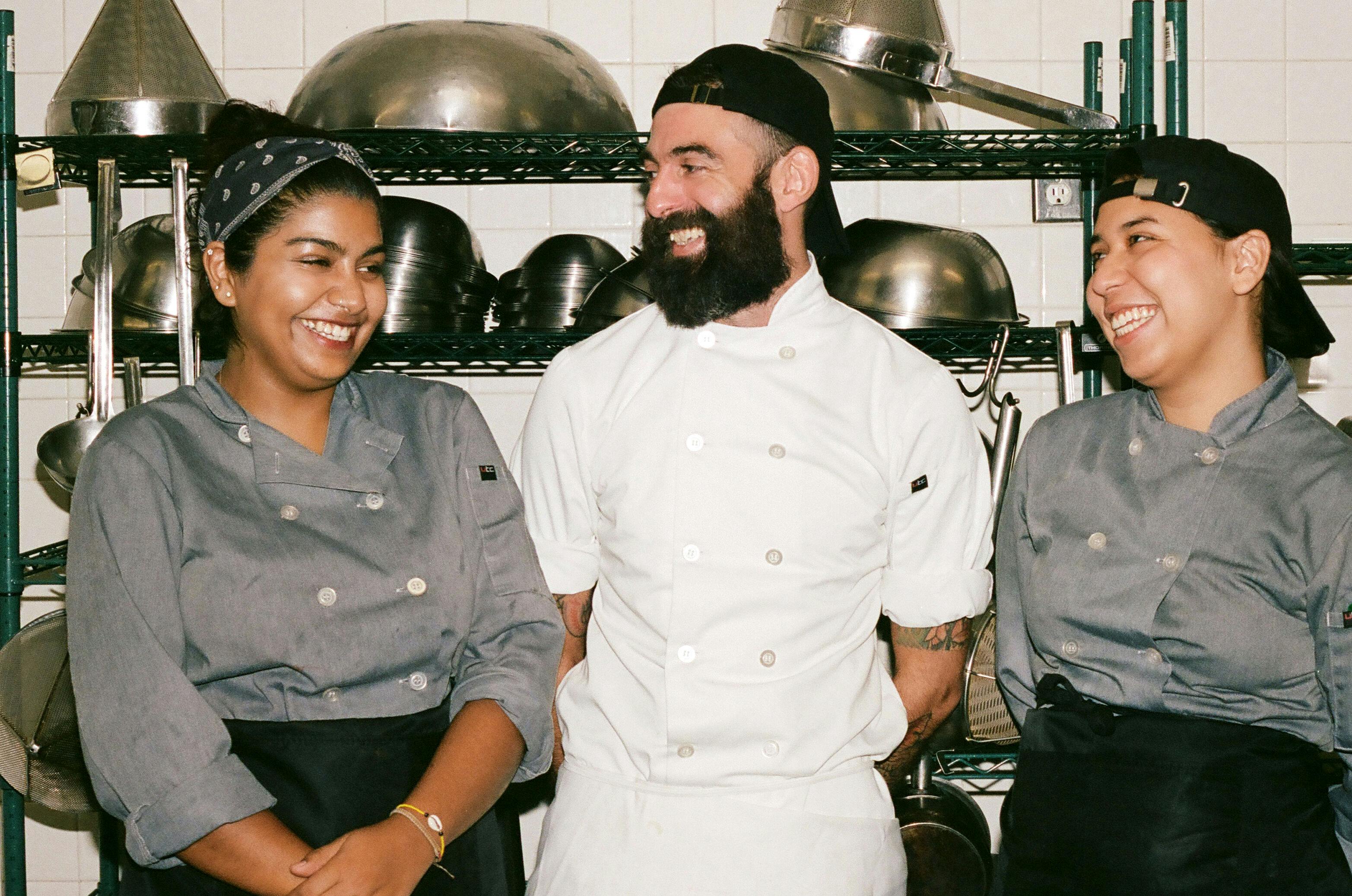 Smiling Chefs in a Commercial Kitchen